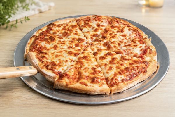 A New York style cheese pizza on a steel pan, cut into eight, gold at the crust.